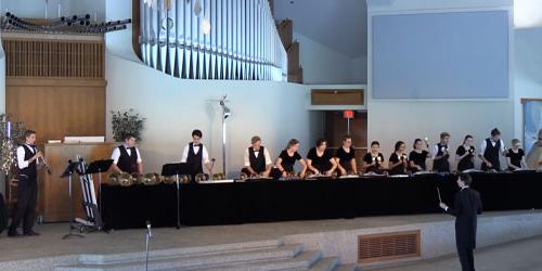 handbell performers in the CU center